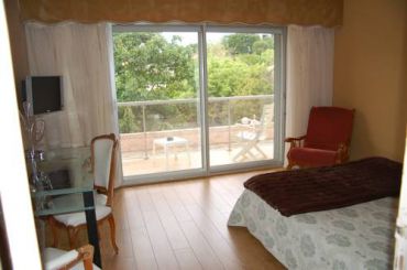 Double or Twin Room with Balcony and Garden View